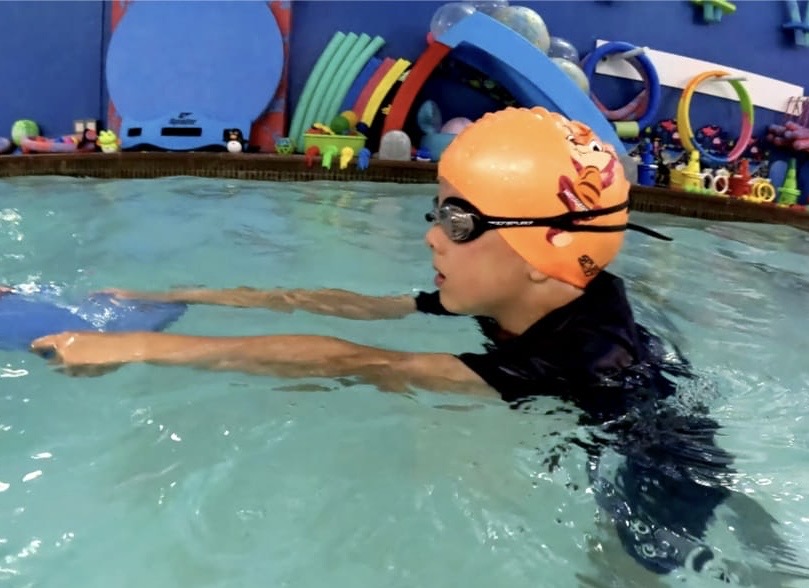 Orange swimming cap tommy tiger